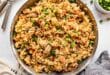 Classic Chinese-style chicken fried rice in a wok
