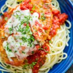 Chicken Parmesan Recipe with marinara sauce and melted mozzarella