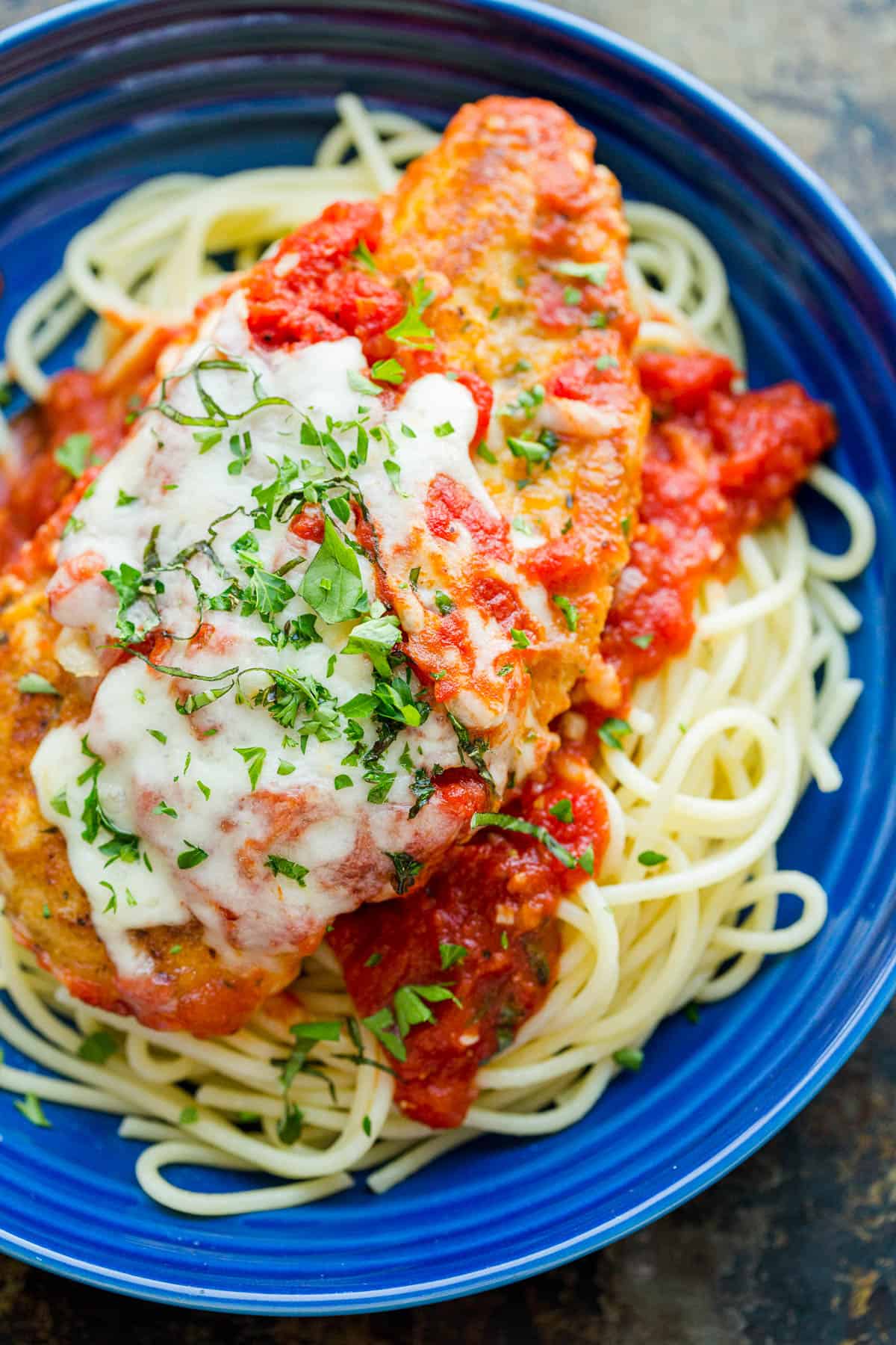 Chicken Parmesan Recipe with marinara sauce and melted mozzarella