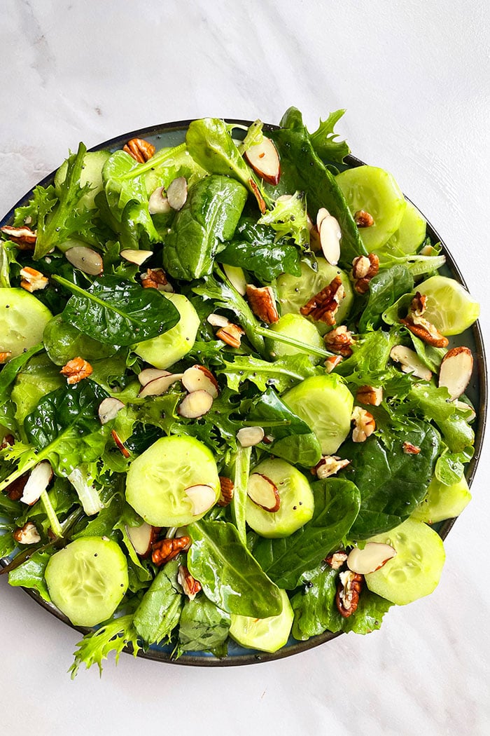 Fresh green salad with lettuce, cucumber, and light vinaigrette