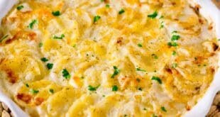 Creamy scalloped potatoes recipe baked with cheese and cream