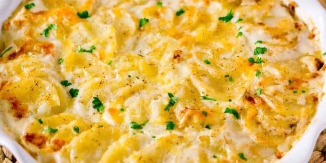 Creamy scalloped potatoes recipe baked with cheese and cream