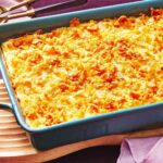 Creamy cheesy funeral potatoes casserole topped with crispy cornflakes