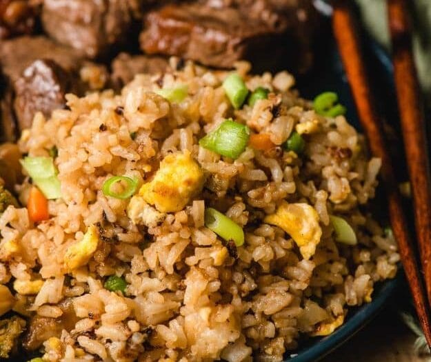 Japanese hibachi fried rice with vegetables, egg, and garlic butter