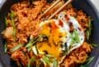 Kimchi Fried Rice Recipe | Easy and Flavorful Korean Dish 14 Spicy kimchi fried rice recipe with egg and green onions