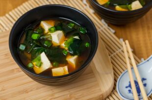 Warm miso soup served with tofu cubes and wakame seaweed