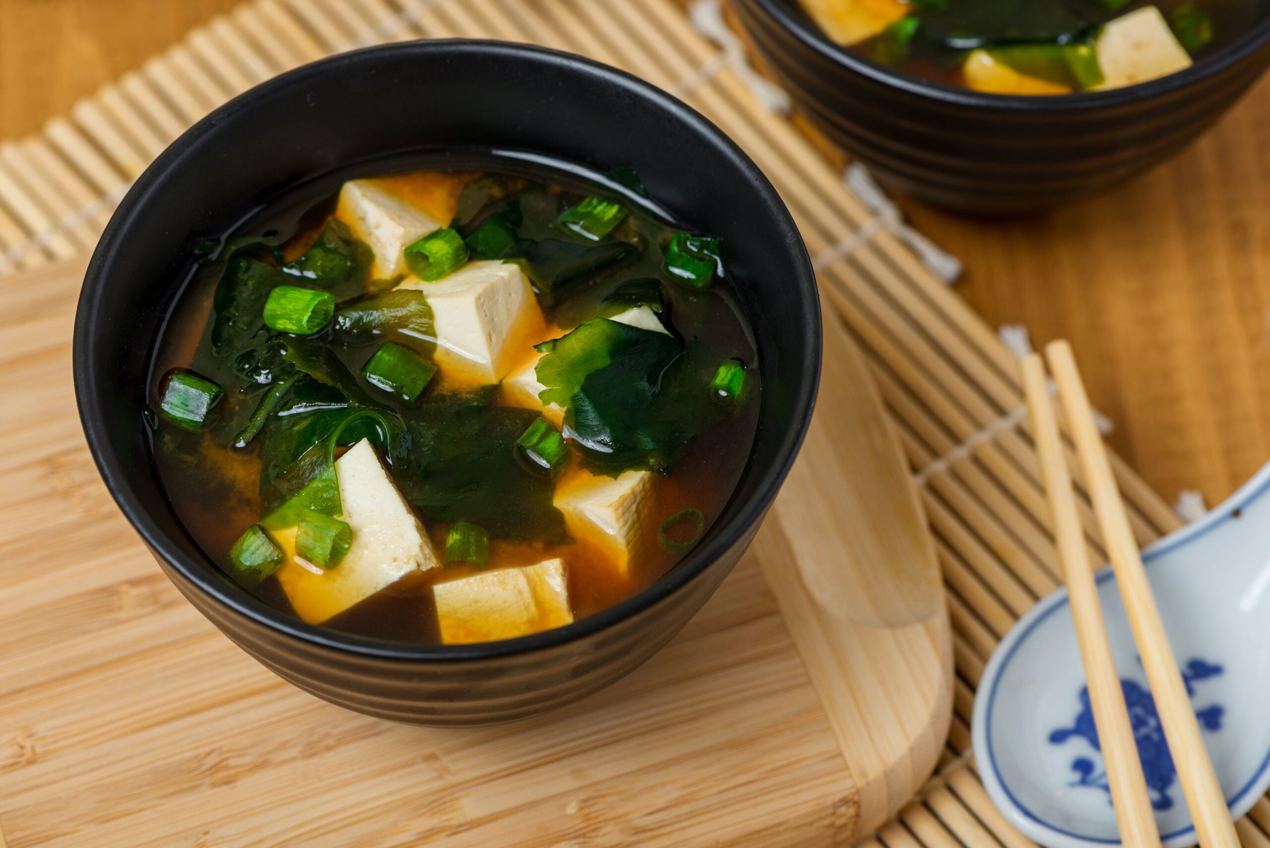 Warm miso soup served with tofu cubes and wakame seaweed
