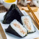 Japanese onigiri rice balls wrapped in seaweed with savory fillings