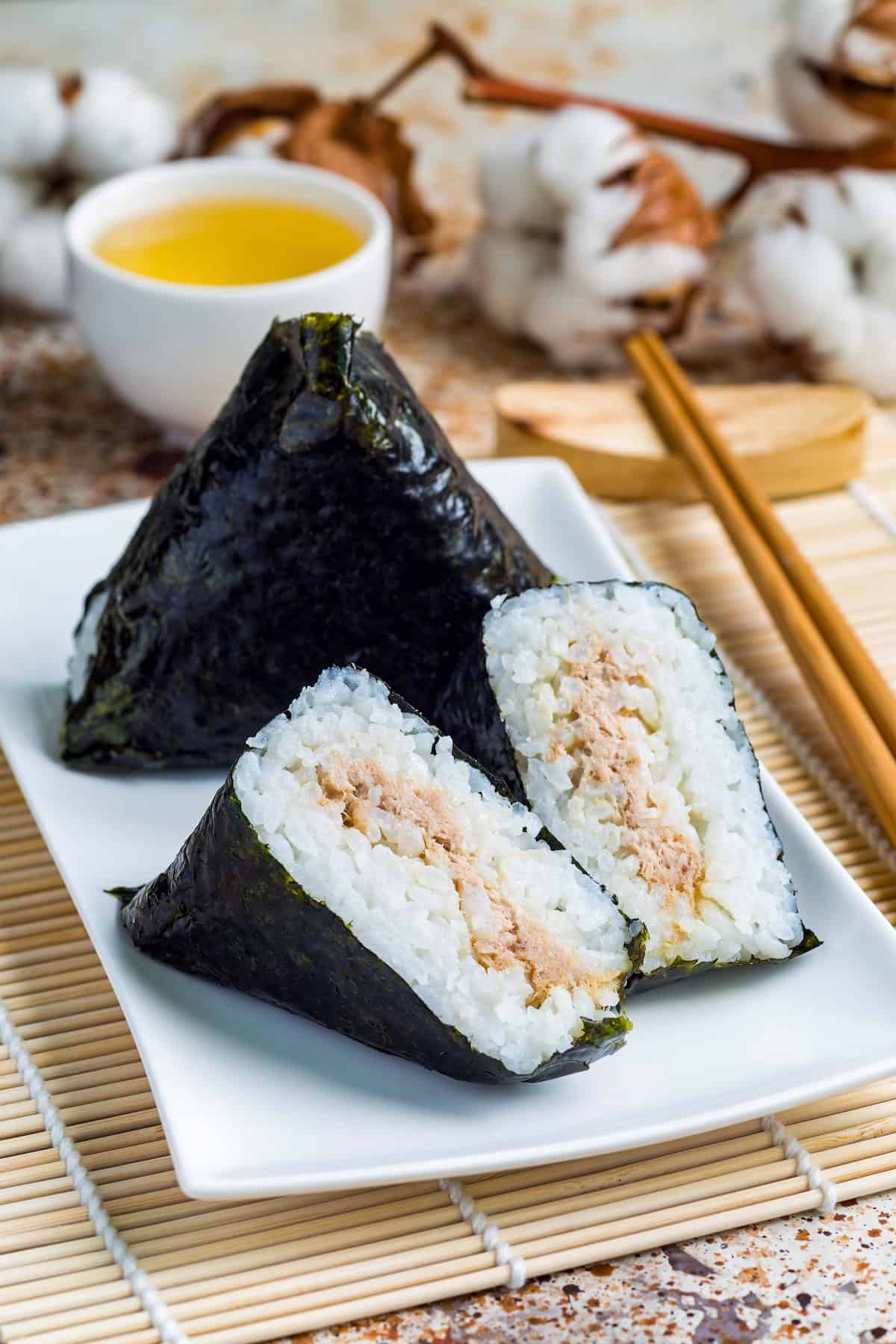 Onigiri Recipe | Traditional Rice Balls with Fillings 1 Japanese onigiri rice balls wrapped in seaweed with savory fillings