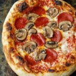 Fresh sourdough pizza dough ready for baking