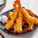 Crispy Japanese tempura shrimp and vegetables with dipping sauce