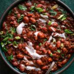 Hearty vegan chili recipe with beans, tomatoes, and vegetables
