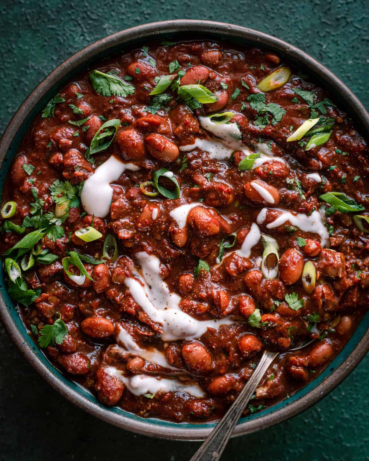 Hearty vegan chili recipe with beans, tomatoes, and vegetables