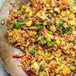 Easy vegetable fried rice recipe with carrots, peas, and soy sauce