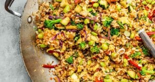 Easy vegetable fried rice recipe with carrots, peas, and soy sauce